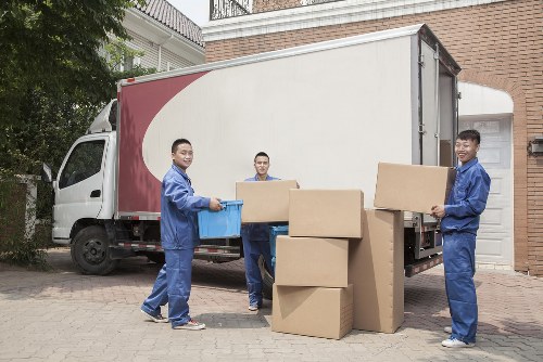 Commercial moving team preparing office equipment for relocation in Ilford