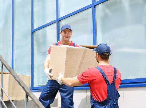 Man and van loading furniture for a move in Ilford