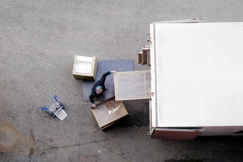 Organised commercial premises move with labelled boxes and workstations