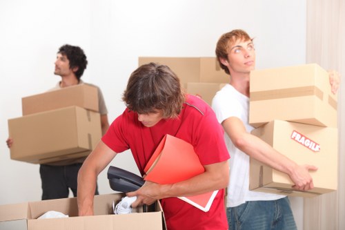 Packed boxes and furniture ready for house removals in an Ilford home