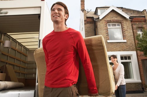 Local moving van loading furniture for an Ilford customer
