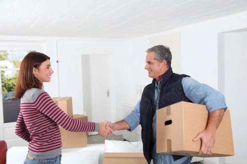 Loading furniture into a removals van for an Ilford move