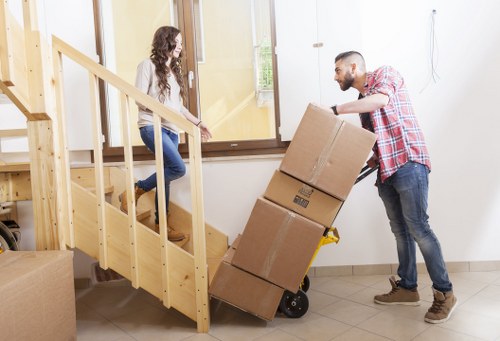 Packed boxes and moving equipment for an Ilford home removal