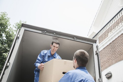 Professional man and van in Ilford loading boxes securely