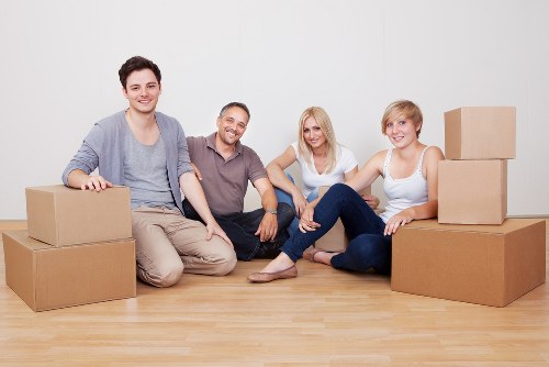 Local movers handling boxes and household items in Ilford